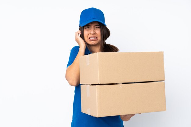 Young delivery brunette girl over isolated white background frustrated and covering ears