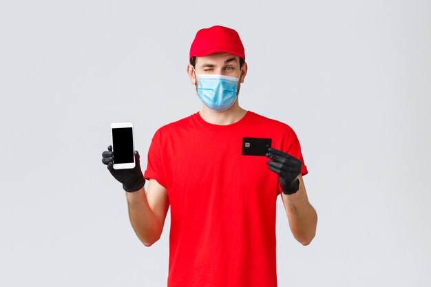 Young delivery man wearing a face mask