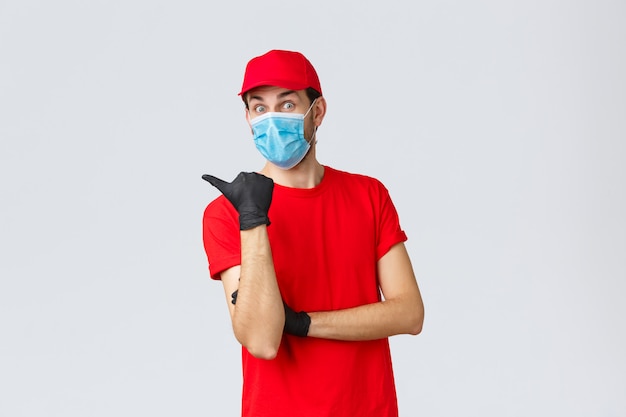 Young delivery man with a cap wearing protective mask