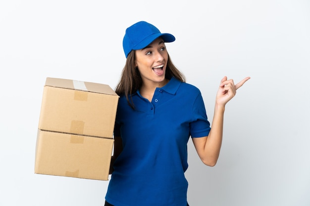 Young delivery woman over isolated white background intending to realizes the solution while lifting a finger up