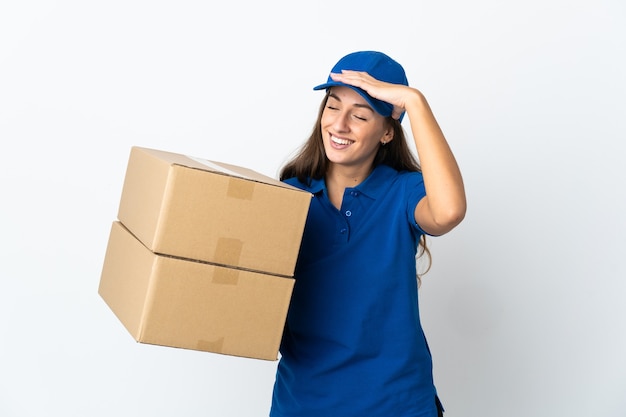 Young delivery woman over isolated white background smiling a lot