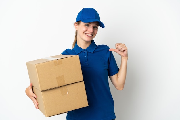 Young delivery woman isolated on white proud and self-satisfied