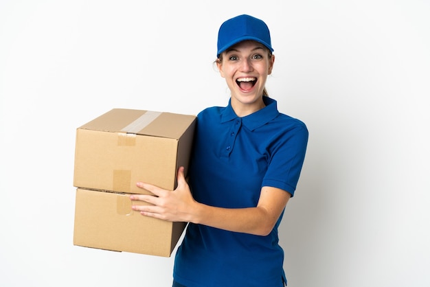 Young delivery woman isolated on white wall with surprise facial expression