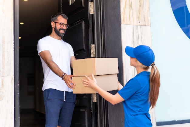 Young delivery woman at outdoors