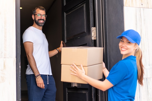 Young delivery woman at outdoors