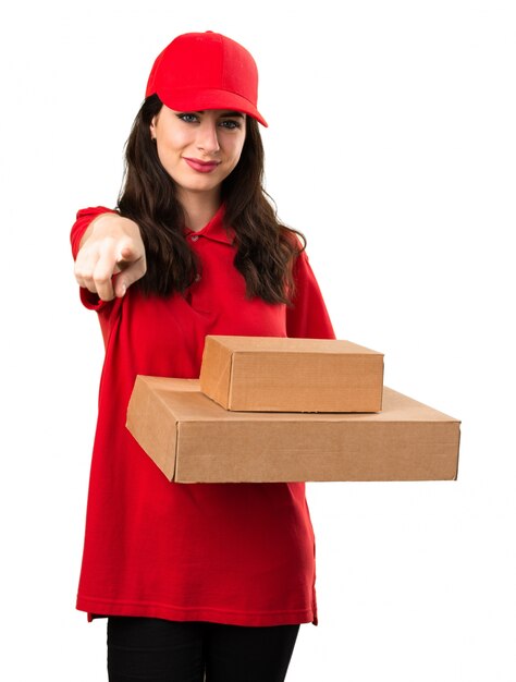 Young delivery woman pointing to the front