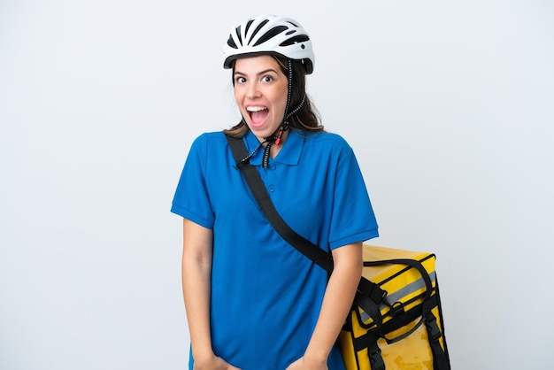 Young delivery woman with thermal backpack isolated on white background with surprise facial expression