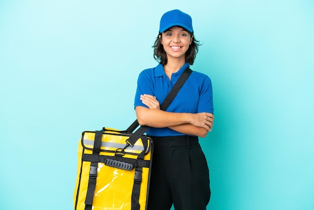 Young delivery woman with thermal backpack keeping the arms crossed in frontal position