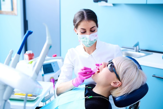 Young dentist at work in the office