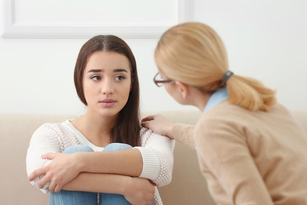 Young depressed woman at psychologist's office