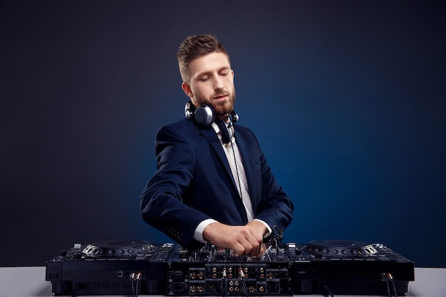 Young DJ in a dark suit