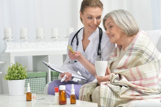 Young doctor and her senior senior patient