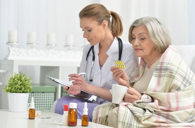 Young doctor and her senior senior patient