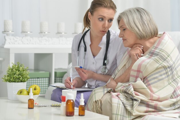 Young doctor and her senior senior patient