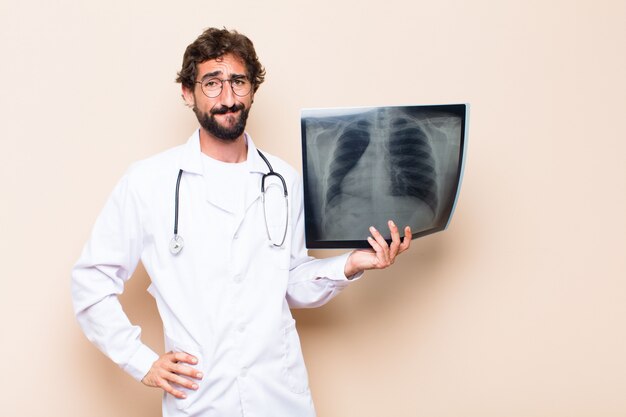 Young doctor holding a bone scan