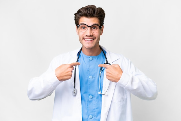 Young doctor man over isolated white background with surprise facial expression