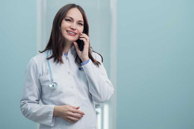 Young doctor provides telephone consultation against flu