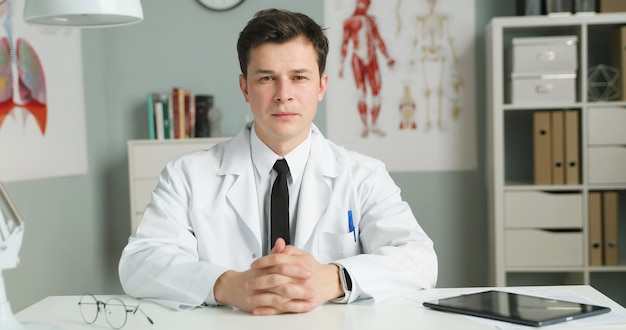 young doctor sitting in medical office