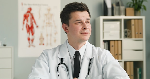 young doctor sitting in medical office