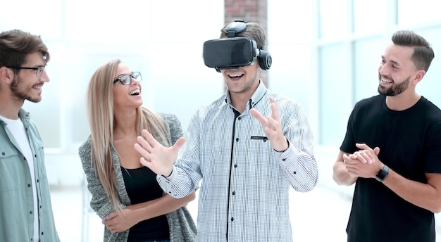 Young doctor watching male in VR goggles