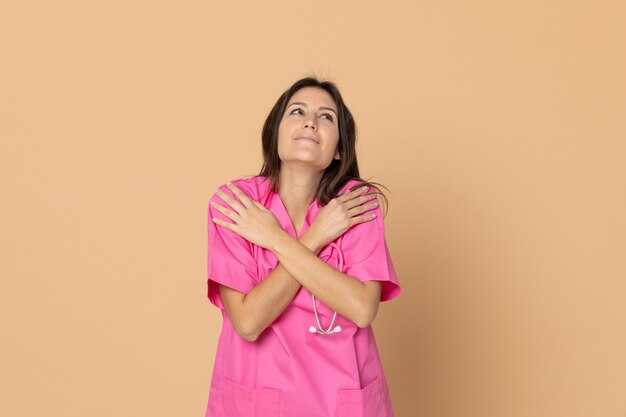 Young doctor wearing pink uniform