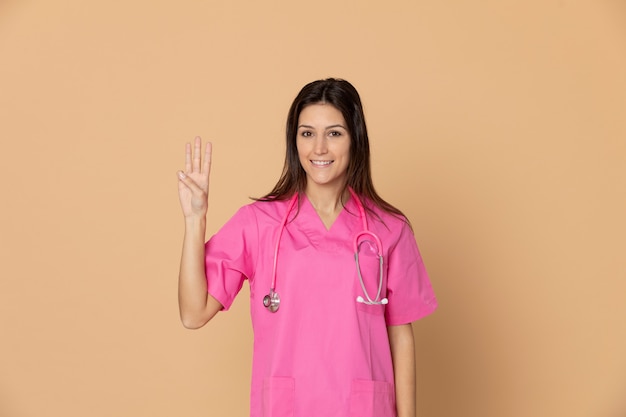 Young doctor wearing pink uniform