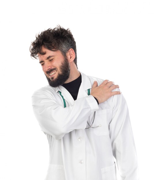 Young doctor with beard wearing a white uniform