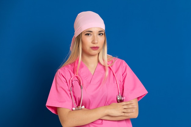 Young doctor with a pink uniform and a scarf