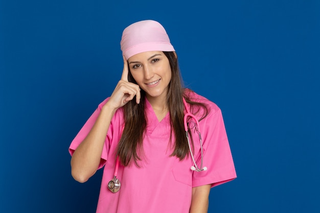 Young doctor with a pink uniform