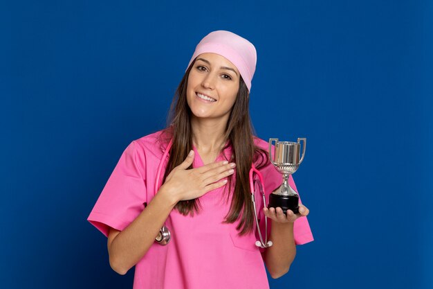 Young doctor with a pink uniform