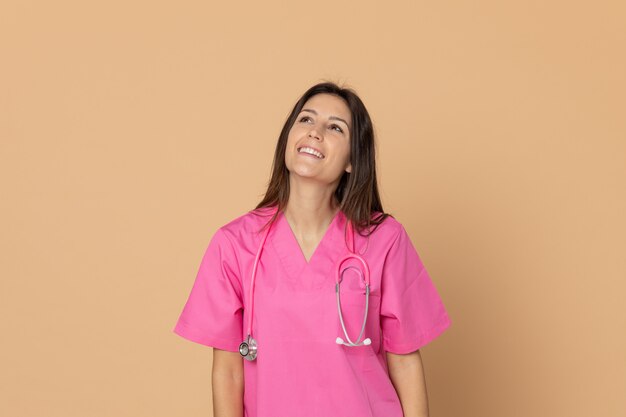 Young doctor with a pink uniform