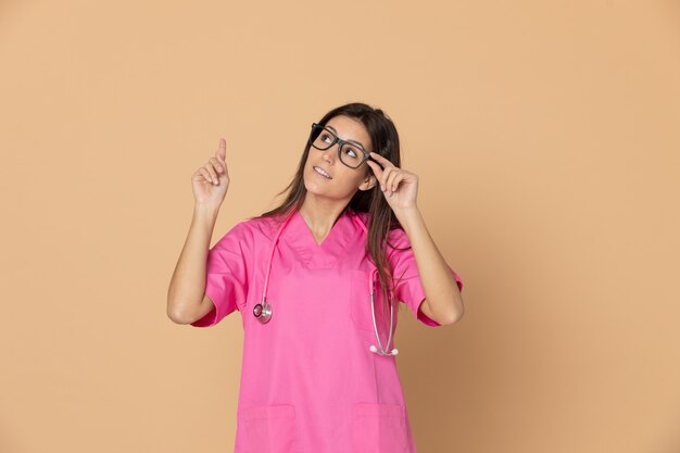 Young doctor with a pink uniform