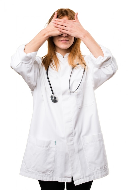 Young doctor woman covering her eyes