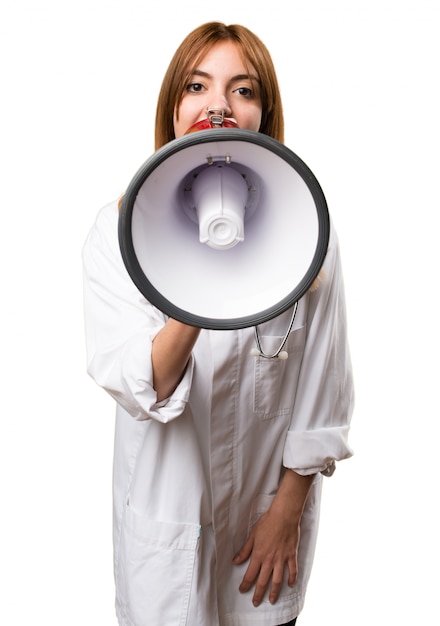 Young doctor woman holding a megaphone