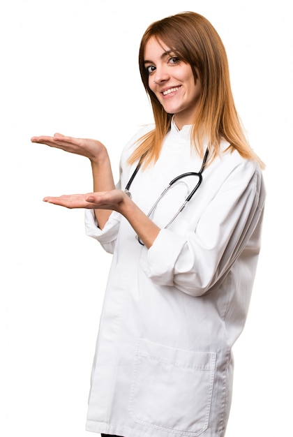 Young doctor woman presenting something