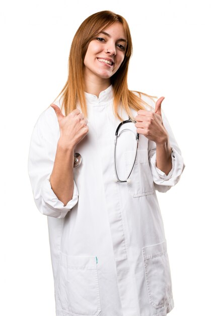 Young doctor woman with thumb up