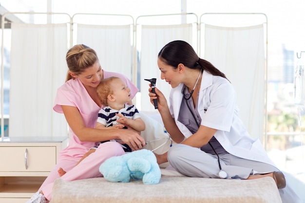 Young doctors attending to a baby