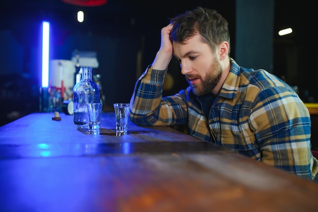 Young drunk man in bar