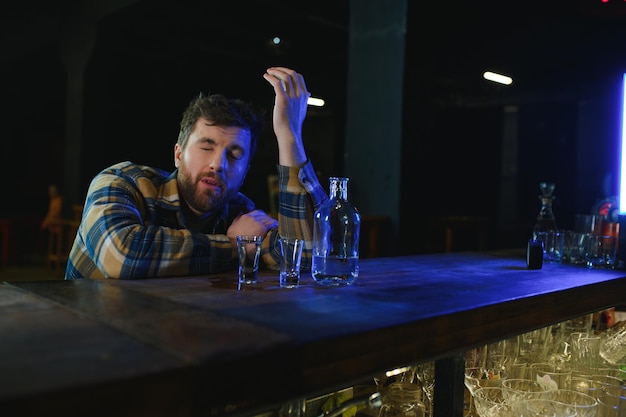 Young drunk man in bar