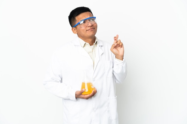 Young Ecuadorian scientific man with fingers crossing and wishing the best