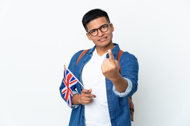 Young Ecuadorian woman holding an United Kingdom flag isolated on white background doing coming gesture