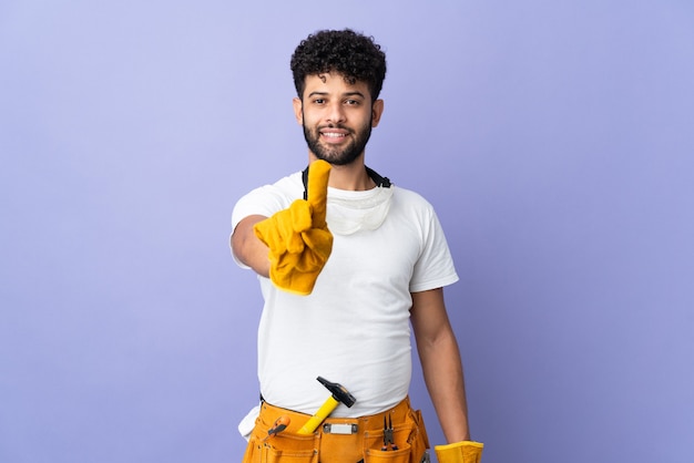 Young electrician Moroccan man isolated