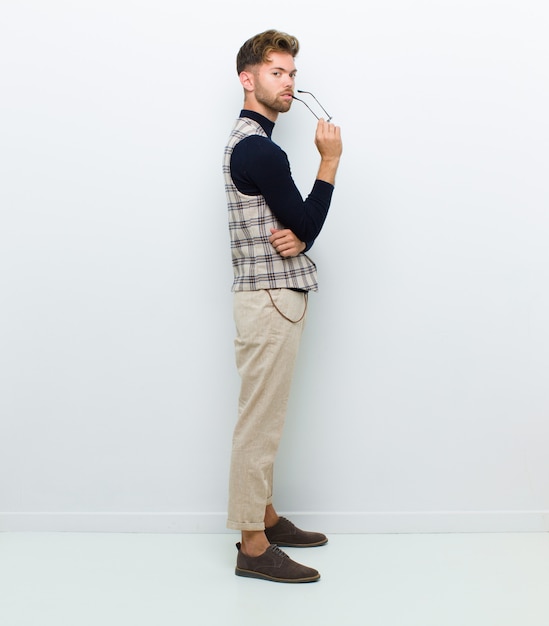 young elegant guy posing confidently