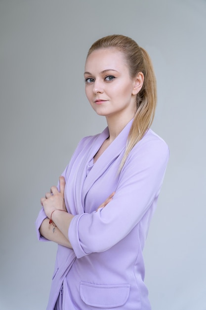 Young elegant woman in stylish suit