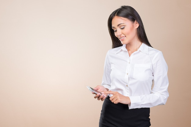 Young elegant woman talking on mobile phone