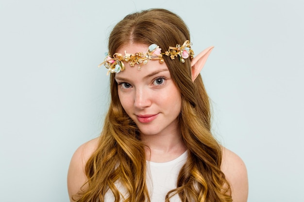 Photo young elf woman isolated on blue background