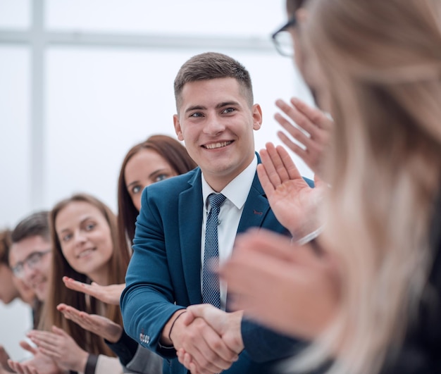 Young employees greeting each other with a handshake