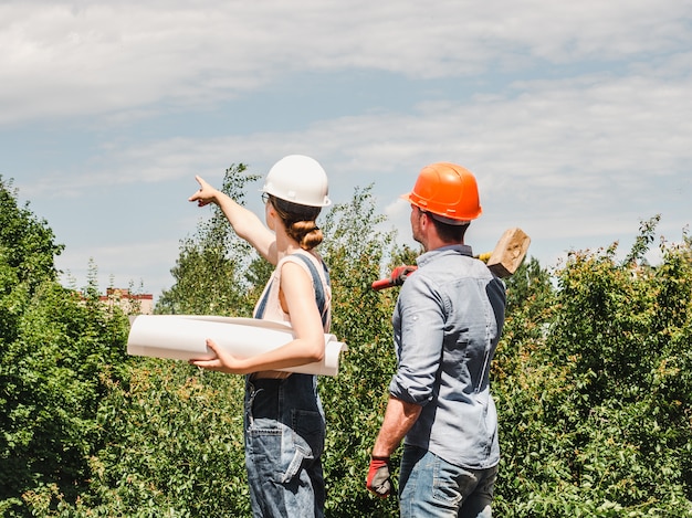 Young engineer woman and her subordinate worker