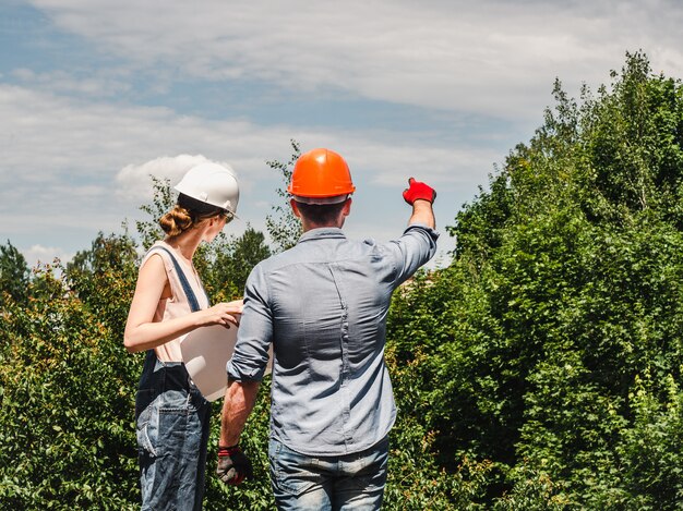 Young engineer and worker in the park. Close-up. Concept of labor and employment