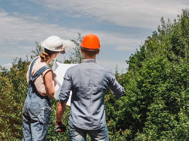 Young engineer and worker in the park